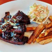 Chulla’S Afro Ribs · Glazed, grilled/slow-cooked pork ribs with coleslaw with Fries or Rice.