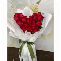 Heart Shaped Bouquet · Heart shaped bouquet with red roses and fluffy wrapping