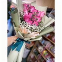 Pink Rose Bouquet · Dozen Pink Rose bouquet with baby breath, greenery, and wrapping. Perfect for any occasion!
