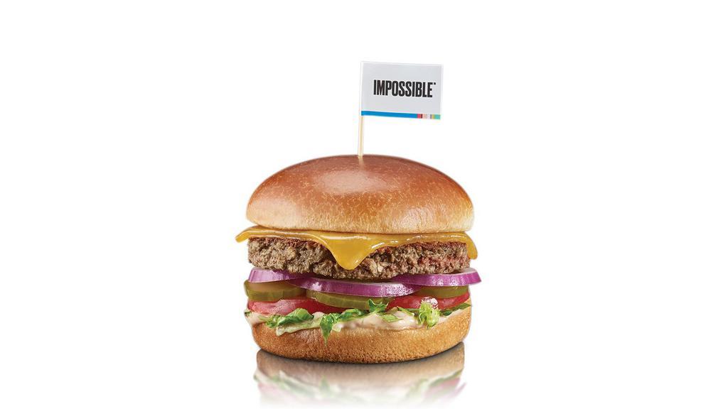 Impossible Burger · Impossible burger, cheddar cheese, red onion, lettuce, tomato, pickles, built sauce, served on a brioche bun.