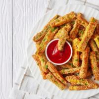 Fresh Zucchini · Fresh zucchini sticks with seasoned bread crumbs, dusted with parmesan and served with marin...