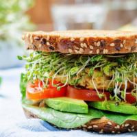 Greek Vegetable Sandwich · Fresh slices of avocado, cucumber, green olive, feta cheese, basil, lettuce, tomatoes with b...