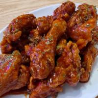 Sweet Chili Sauce Chicken Wings · Fresh bone-in chicken wings tossed in a house made sweet chili sauce and served with a side ...