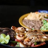 Fajitas De Res/Beef · Beef fajita with tomatoes, onions, peppers, potato wedges  served with rice, beans, salad, a...