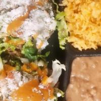2 Sopes (Hand Made) With Rice And Beans · Includes beans, lettuce, pico de gallo, sour cream, cheese, and salsa
