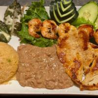 Plato Mar Y Tierra · Served with shrimp, chicken, rice, beans, cheese peppers