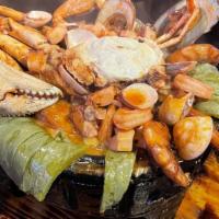 Molcajete De Mariscos · Green muscles, green onions, Grilled chile, avocado, shrimp, prawns, scallops, crab, octopus...