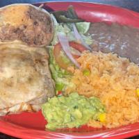 (Combinacion) De Super Burrito With Rice And Beans  · Includes meat, rice, beans, lettuce, pico de gallo, cheese, sour cream, guacamole, and salsa...