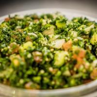 Tabbouleh · Finely Chopped Parsley Mixed with Tomatoes, Onions, Cucumber And Wheat (Bulgur) with Lemon J...