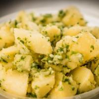 Potato Salad · Cooked Potatoes Tossed with Garlic, Lemon, Olive Oil and Parsley and Spices.
