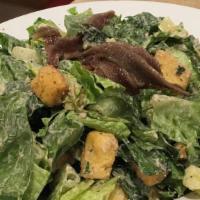 Caesar · Crisp romaine lettuce topped with parmesan cheese and croutons, then tossed with caesar dres...