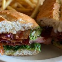 Blta · 1/2lb applewood smoked bacon, avocado, tomato, romaine and mayo on french roll with fries