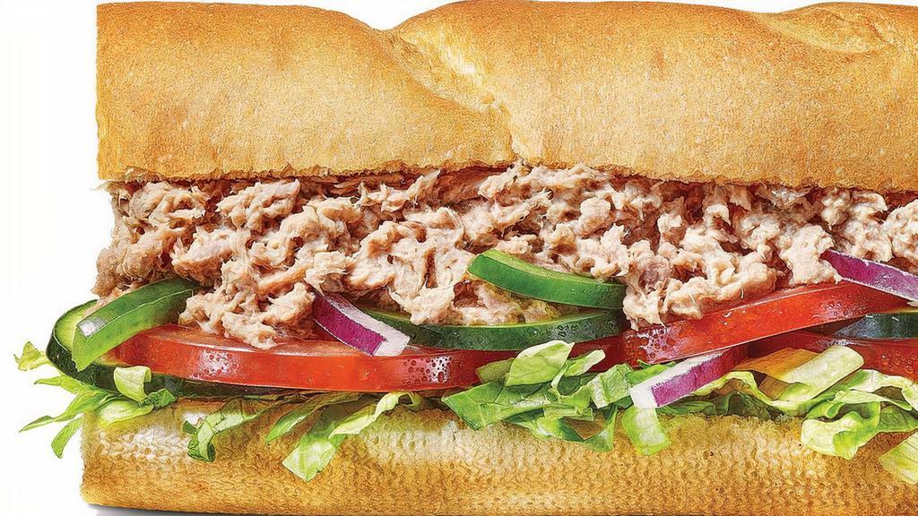 Tuna Footlong Regular Sub · You’ll love every bite of our classic tuna sandwich. 100% wild caught tuna blended with creamy mayo then topped with your choice of crisp, fresh veggies. 100% delicious..