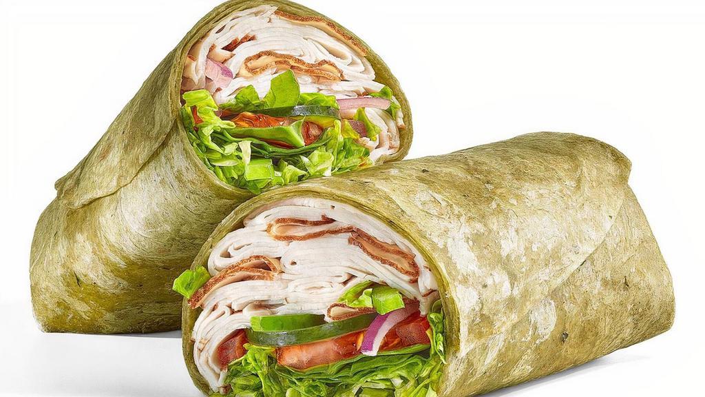 Oven Roasted Turkey · Our Oven Roasted Turkey Wrap is a go-to. It's a footlong portion of our premium, thin-sliced, oven roasted turkey, with fresh veggies like lettuce, tomatoes, baby spinach, cucumbers, green peppers and red onions, all served up in a spinach wrap.