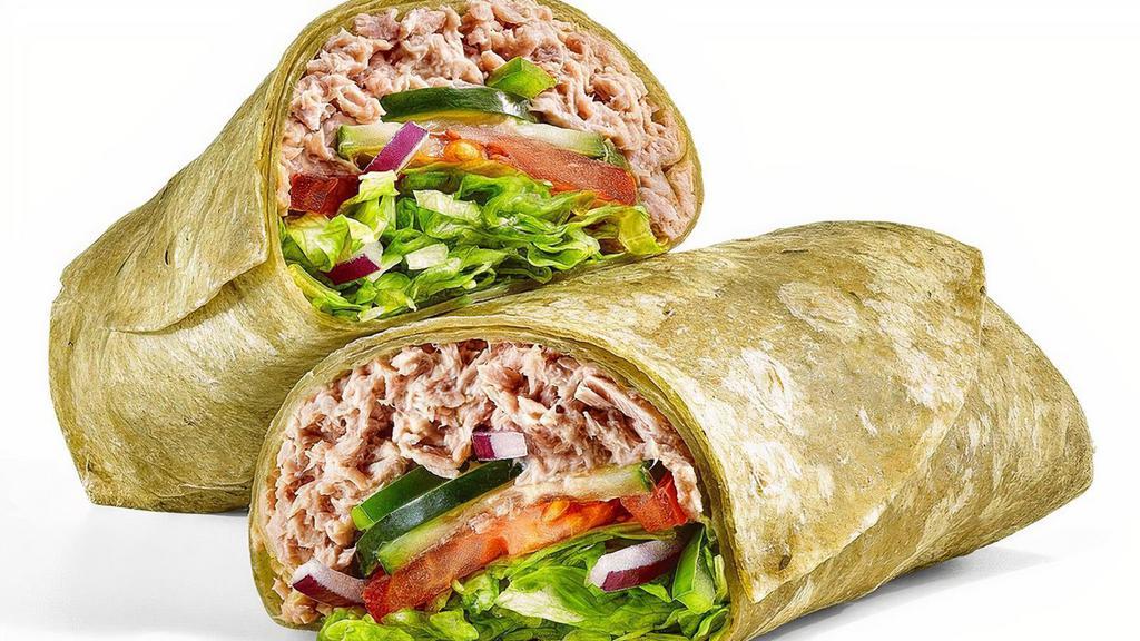 Tuna · Our tasty Tuna Wrap is completely cravable. It has a double serving of 100% wild caught tuna mixed with mayo in a spinach wrap. Then it gets topped with any crunchy veggies you want.