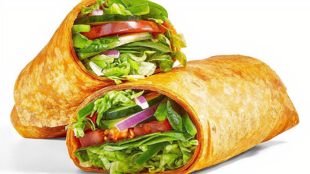 Veggie Delite® · The Veggie Delite® wrap has a double portion of the fresh veggies you love. All wrapped in a flavorful tomato basil wrap with lettuce, tomatoes, spinach, green peppers, cucumbers, and red onions. It's one bold, crunchy flavor combo.