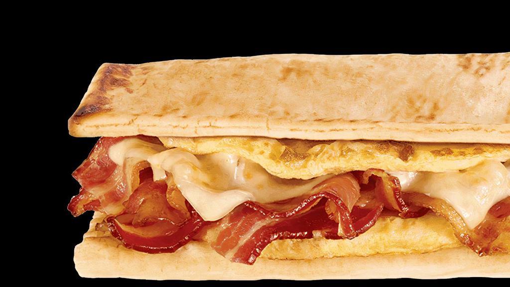 Bacon, Egg & Cheese 6 Inch With Regular Egg · Start your day in a sizzlin' way with  bacon, egg, and melty cheese on freshly toasted flatbread (or whatever you like). Pile on your favorite veggies and sauce. Start the day right.