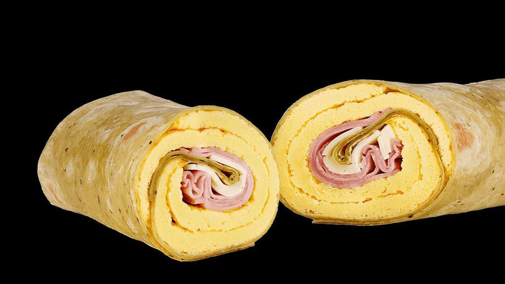Black Forest Ham, Egg & Cheese Wrap · Helllooo delicious! Enjoy a Spinach wrap filled with American cheese and a double portion of savory Black Forest ham and egg. What a tasty way to start the day!