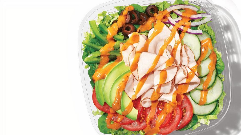 Baja Turkey With Sliced Avocado · Spice up your salad with Oven-Roasted Turkey, and Sliced Avocado, on a bed of greens and crisp veggies and topped with Baja Chipotle sauce.