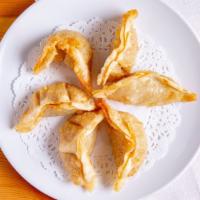 Potstickers (6 Pieces) · Chicken and vegetables in it.