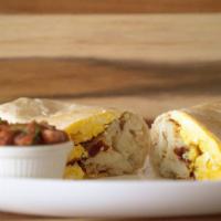 Breakfast Burrito · Choice of Bacon, Chorizo, Steak or Sausage 
Includes: 2 scrambled eggs, cheese, hash brown