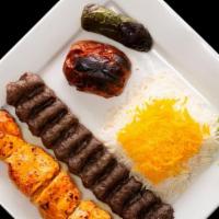 Combo Kebab · Marinated pieces of chicken breast and a skewer of a ground beef served with rice, grilled t...