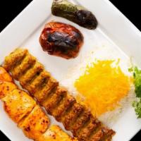 Chicken Soltani · Marinated pieces of chicken breast and a skewer of ground up chicken thigh served with rice,...
