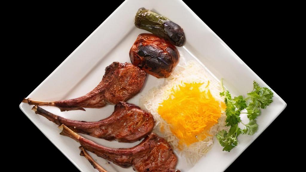 Lamb Chop Kebab · Pieces of marinated grilled lamb served with rice, grilled tomato and jalapeño.