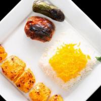 Chichen Breast Kebab · Marinated pieces of chicken breast served with rice, grilled tomato and jalapeño.