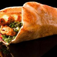 Chicken Luleh Wrap · Grounded chicken breast with raw onions, parsley, somak and tomatoes served on lavash bread.