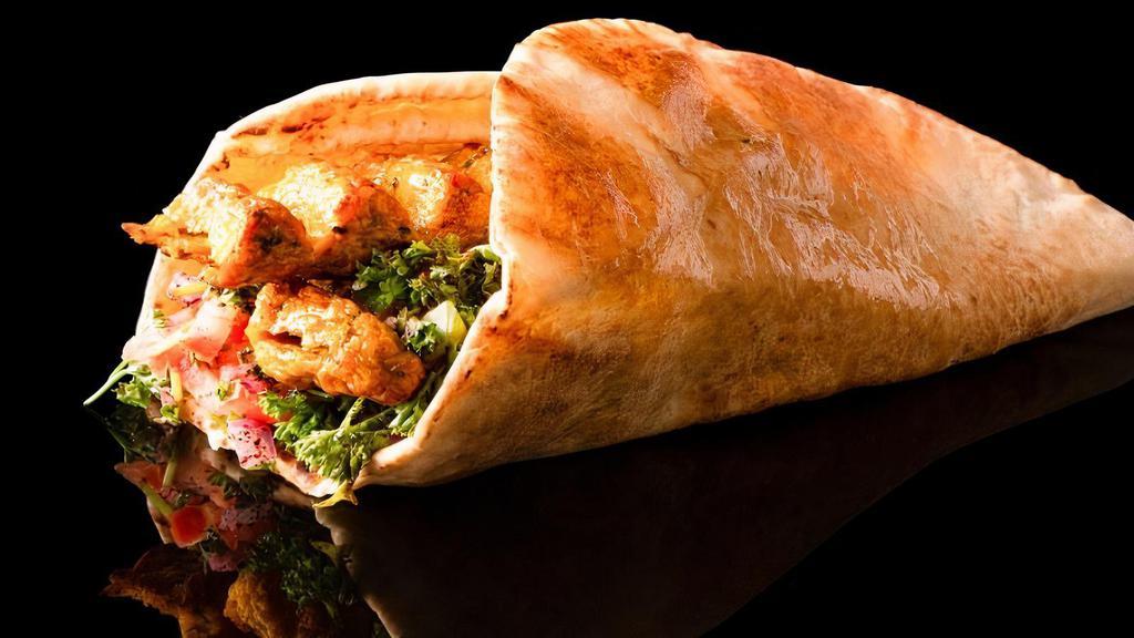 Chicken Luleh Wrap · Grounded chicken breast with raw onions, parsley, somak and tomatoes served on lavash bread.