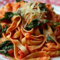 Tomato Basil Fettuccini · Housemade tomato sauce, garlic, basil and olive oil.
