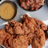 Southern Fried Chicken · half of a boneless chicken, roasted garlic mashed potatoes, braised southern greens, apple c...