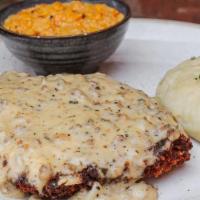 Chicken Fried Steak · breaded steak cutlet, country gravy, roasted garlic mashed potatoes, creamed corn