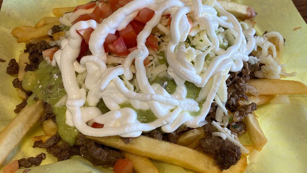 Papa Nachos (Nacho Fries) · Fries, your choice of meat, onions, cilantro, beans, guacamole, tomatoes, cheese, sour cream.