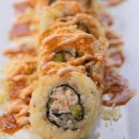 Crunchy Munchy · 8pc california roll, in tempura, topped with crunchies & house sauces