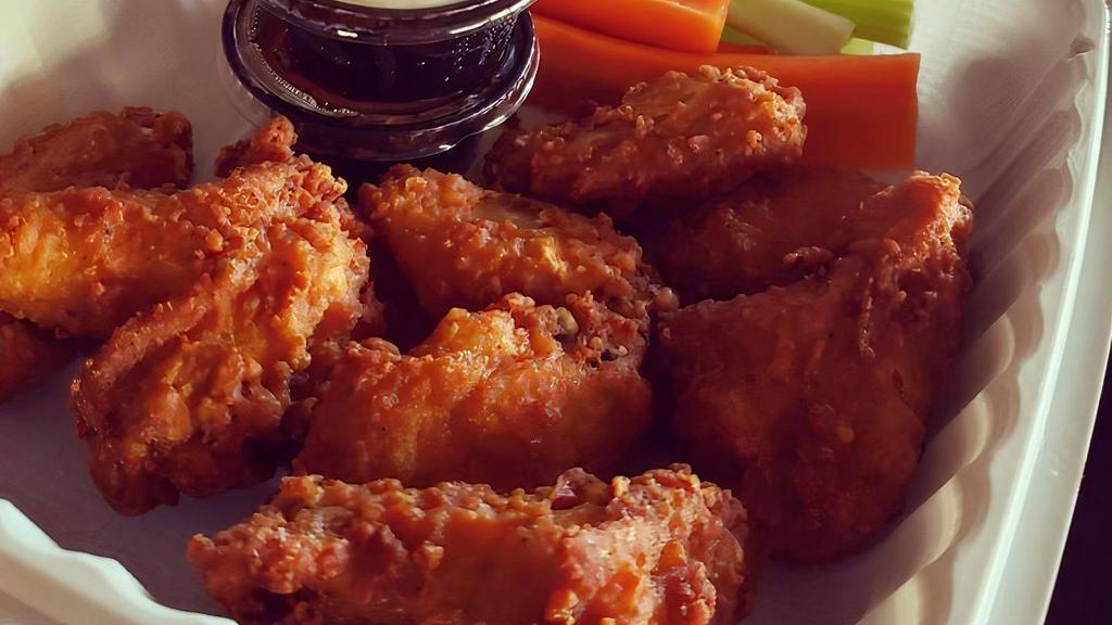 Chicken Wings · Wet or dry with choice of sauce (traditional hot, teriyaki, spicy szechuan). Served with ranch dressing, carrots, and celery