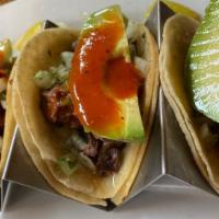 Street Tacos · Three chicken or carnitas tacos with cilantro, onion and salsa roja (substitute carne asada ...