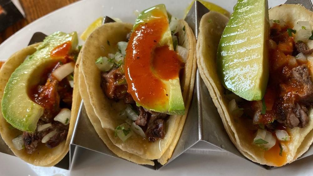 Street Tacos · Three chicken or carnitas tacos with cilantro, onion and salsa roja (substitute carne asada for an extra charge)
