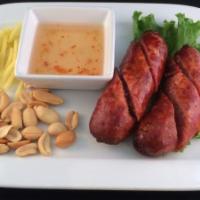 Thai Style Sausages (2) · Thai traditional northeastern style sausage, deep fried to golden brown. Served with peanut,...