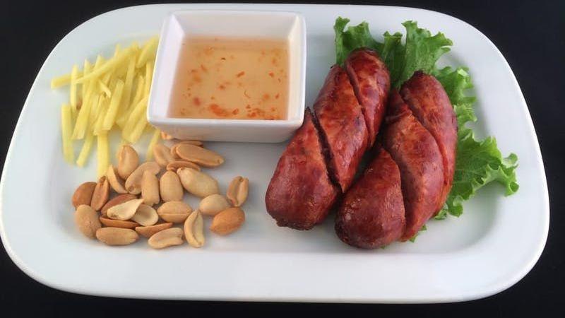 Thai Style Sausages (2) · Thai traditional northeastern style sausage, deep fried to golden brown. Served with peanut, fresh ginger, sweet and sour sauce.