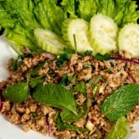 Larb · Choice of ground chicken, ground pork or ground beef tossed in red onions, mint leaves, cila...