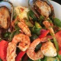 Yum Shrimp · Shrimps tossed with red onions, tomatoes, cucumber, mints, cilantro in fresh lime juices, an...