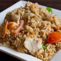 Thai Fried Rice · Stir fried rice with onion, carrot, green peas, egg and your choice of meat.
