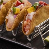 Mango Ceviche Tacos  · Served in crispy taco shells. Your choice of Lobster, octopus, whitefish and shrimp mixed wi...