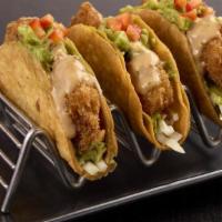 “Ra”Ckin’ Shrimp Tacos  · Served in crispy taco shells, “RA”ckin’ Shrimp, Asian coleslaw and guacamole topped with gin...