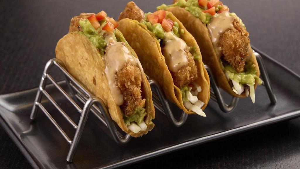 “Ra”Ckin’ Shrimp Tacos  · Served in crispy taco shells, “RA”ckin’ Shrimp, Asian coleslaw and guacamole topped with ginger teriyaki sauce and red bell pepper served in a crispy gyoza shell..