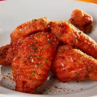 Chili Ponzu Wings · Lightly breaded and fried to perfection. Tossed in a Chili Ponzu Sauce.