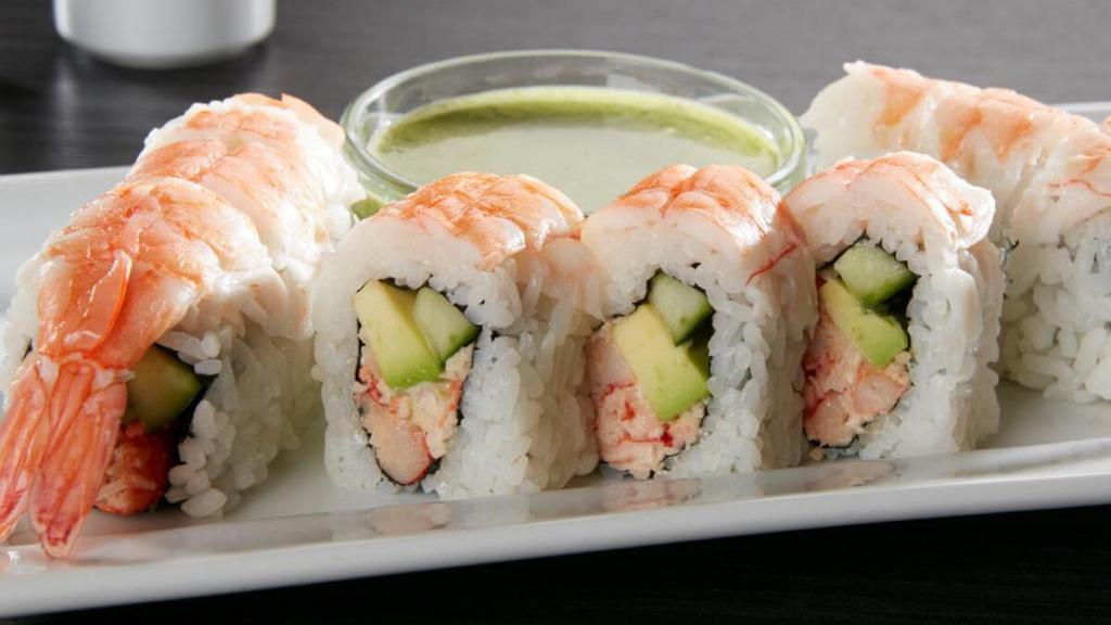 Lobster Shrimp Roll · Lobster krab† mix, cucumber and avocado rolled and topped with shrimp; served with Asian pesto sauce