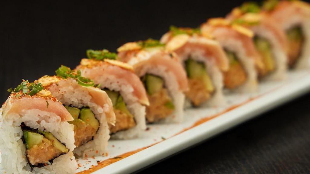 Hot Night Roll · Spicy albacore mix rolled with cucumber and avocado; topped with albacore, chili mayo, green onions and garlic chips; served with chili ponzu sauce